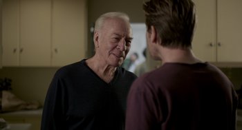 Movie still from “Beginners” (2010), directed by Mike Mills – Two men talking to each other in a room; Close Up shot, Over the shoulder angle