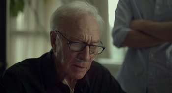 Movie still from “Beginners” (2010), directed by Mike Mills – An older man wearing glasses and a black shirt; Close Up shot, Low angle