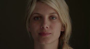 Movie still from “Beginners” (2010), directed by Mike Mills – A woman's face with green eyes; Close Up shot, Low angle