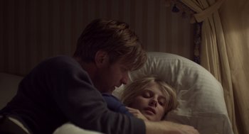 Movie still from “Beginners” (2010), directed by Mike Mills – A man and a woman laying in a bed together; Close Up shot, Overhead angle