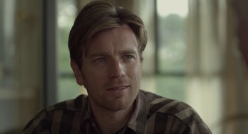 Movie still from “Beginners” (2010), directed by Mike Mills – A person wearing a plaid shirt; Close Up shot, Over the shoulder angle