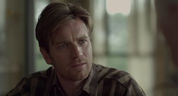 Movie still from “Beginners” (2010), directed by Mike Mills – A person wearing a plaid shirt; Close Up shot, Over the shoulder angle