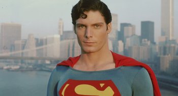 Movie still from “Beginners” (2010), directed by Mike Mills – A person wearing a superman costume; Close Up shot, Over the shoulder angle