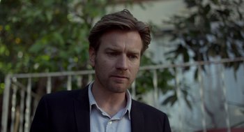 Movie still from “Beginners” (2010), directed by Mike Mills – A person wearing a suit and tie; Close Up shot, Over the shoulder angle