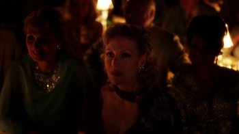 Movie still from “Behind the Candelabra” (2013), directed by Steven Soderbergh – A person wearing a dress; Close Up shot, Over the shoulder angle