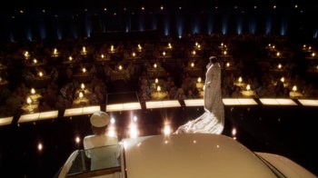 Movie still from “Behind the Candelabra” (2013), directed by Steven Soderbergh – A woman in a white dress standing in front of an audience; Extreme Wide shot, High angle