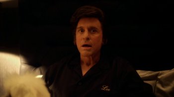 Movie still from “Behind the Candelabra” (2013), directed by Steven Soderbergh – A person wearing a black shirt; Close Up shot, Low angle