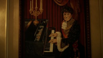 Movie still from “Behind the Candelabra” (2013), directed by Steven Soderbergh – A painting of a man playing the piano; Medium shot, High angle