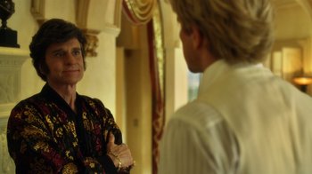 Movie still from “Behind the Candelabra” (2013), directed by Steven Soderbergh – A man and a woman are talking in a room; Close Up shot, Over the shoulder angle