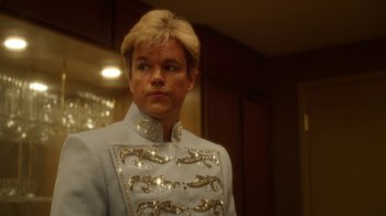 Movie still from “Behind the Candelabra” (2013), directed by Steven Soderbergh – A man wearing a white suit with silver embellishments; Close Up shot, Low angle