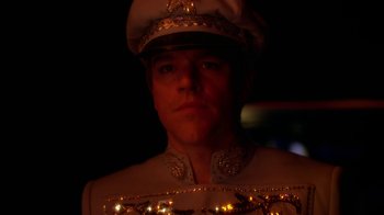 Movie still from “Behind the Candelabra” (2013), directed by Steven Soderbergh – A person wearing a uniform; Close Up shot, Low angle