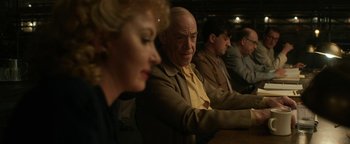 Movie still from “Being the Ricardos” (2021), directed by Aaron Sorkin – A group of people sitting at a table in a room; Medium shot, Over the shoulder angle