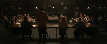 Movie still from “Being the Ricardos” (2021), directed by Aaron Sorkin – A group of people sitting at tables in front of a stage; Wide shot, High angle