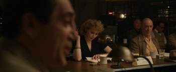 Movie still from “Being the Ricardos” (2021), directed by Aaron Sorkin – A woman sitting at a table with a cup of coffee; Medium shot, Over the shoulder angle