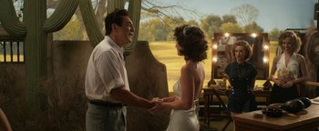 Movie still from “Being the Ricardos” (2021), directed by Aaron Sorkin – A man and a woman holding hands and smiling at each other; Medium shot, Over the shoulder angle