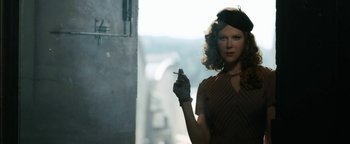 Movie still from “Being the Ricardos” (2021), directed by Aaron Sorkin – A woman holding a cigarette in her right hand; Close Up shot, Low angle