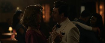 Movie still from “Being the Ricardos” (2021), directed by Aaron Sorkin – A man and a woman are dancing in a dark room; Medium shot, Low angle