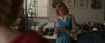 Movie still from “Being the Ricardos” (2021), directed by Aaron Sorkin – A woman standing in front of a sink holding papers; Medium shot, Over the shoulder angle