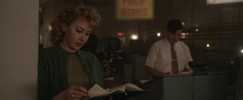 Movie still from “Being the Ricardos” (2021), directed by Aaron Sorkin – A woman is reading a book in front of a man; Medium shot, Over the shoulder angle
