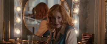 Movie still from “Being the Ricardos” (2021), directed by Aaron Sorkin – A woman sitting in front of a mirror in front of a makeup mirror; Close Up shot, Over the shoulder angle