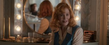 Movie still from “Being the Ricardos” (2021), directed by Aaron Sorkin – A woman sitting in front of a mirror in a room; Close Up shot, Over the shoulder angle