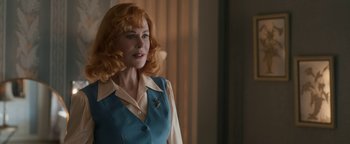 Movie still from “Being the Ricardos” (2021), directed by Aaron Sorkin – A woman with red curly hair and a blue jacket; Close Up shot, Over the shoulder angle