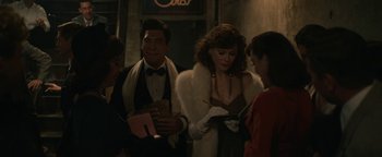 Movie still from “Being the Ricardos” (2021), directed by Aaron Sorkin – A group of people standing next to each other in a room; Medium shot, Over the shoulder angle