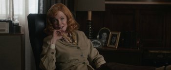 Movie still from “Being the Ricardos” (2021), directed by Aaron Sorkin – A woman with red hair sitting on a chair; Medium shot, Over the shoulder angle