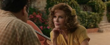 Movie still from “Being the Ricardos” (2021), directed by Aaron Sorkin – A woman in a yellow shirt holding a guitar; Close Up shot, Over the shoulder angle