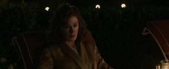 Movie still from “Being the Ricardos” (2021), directed by Aaron Sorkin – A woman in a brown coat standing in front of a moon; Close Up shot, Over the shoulder angle