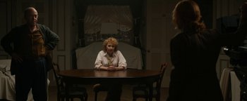 Movie still from “Being the Ricardos” (2021), directed by Aaron Sorkin – A woman sitting at a table in front of another woman; Medium shot, Over the shoulder angle