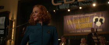 Movie still from “Being the Ricardos” (2021), directed by Aaron Sorkin – A red headed woman in a blue dress; Medium shot, Over the shoulder angle