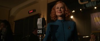 Movie still from “Being the Ricardos” (2021), directed by Aaron Sorkin – A woman standing in front of a microphone in a room; Medium shot, Low angle