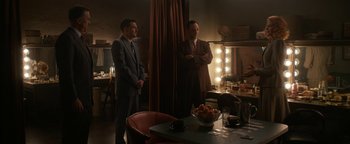 Movie still from “Being the Ricardos” (2021), directed by Aaron Sorkin – A couple of men standing next to each other in a room; Wide shot, Low angle