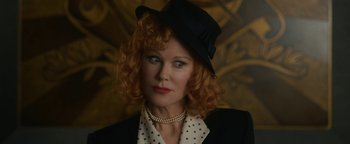 Movie still from “Being the Ricardos” (2021), directed by Aaron Sorkin – A person wearing a suit and hat; Close Up shot, Low angle