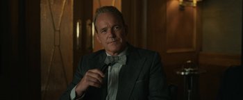 Movie still from “Being the Ricardos” (2021), directed by Aaron Sorkin – A man in a suit and a bow tie; Close Up shot, Over the shoulder angle