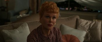 Movie still from “Being the Ricardos” (2021), directed by Aaron Sorkin – A person sitting on a couch; Close Up shot, Over the shoulder angle