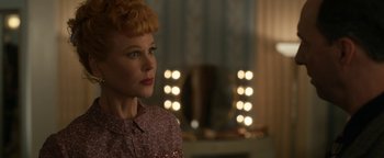 Movie still from “Being the Ricardos” (2021), directed by Aaron Sorkin – A woman with red hair is looking at a mirror; Close Up shot, Over the shoulder angle
