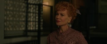 Movie still from “Being the Ricardos” (2021), directed by Aaron Sorkin – A person wearing a dress; Close Up shot, Over the shoulder angle