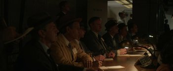 Movie still from “Being the Ricardos” (2021), directed by Aaron Sorkin – A group of men sitting at a table in a room; Medium shot, High angle