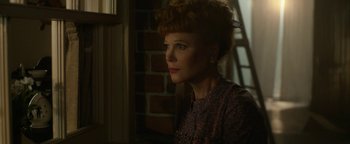 Movie still from “Being the Ricardos” (2021), directed by Aaron Sorkin – A woman in a dress is looking out of a window; Close Up shot, Low angle