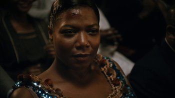 Movie still from “Bessie” (2015), directed by Dee Rees – A person wearing a dress; Close Up shot, High angle