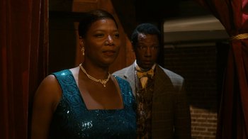 Movie still from “Bessie” (2015), directed by Dee Rees – A man and a woman standing next to each other; Medium shot, Over the shoulder angle