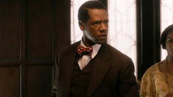 Movie still from “Bessie” (2015), directed by Dee Rees – A man wearing a suit and a bow tie; Close Up shot, Low angle