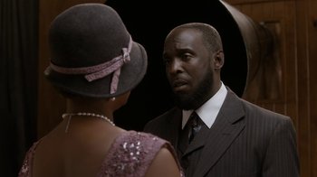 Movie still from “Bessie” (2015), directed by Dee Rees – A man and a woman looking at each other in a mirror; Close Up shot, Over the shoulder angle