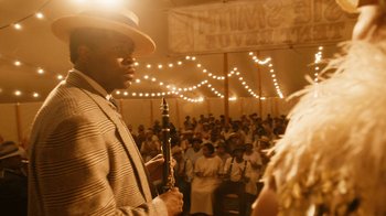 Movie still from “Bessie” (2015), directed by Dee Rees – A crowd of people are gathered in front of an audience; Medium shot, Low angle
