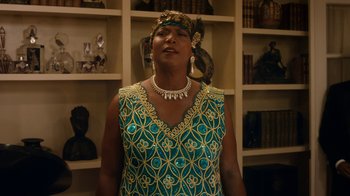 Movie still from “Bessie” (2015), directed by Dee Rees – An older woman wearing a blue dress and a head piece; Medium shot, Low angle