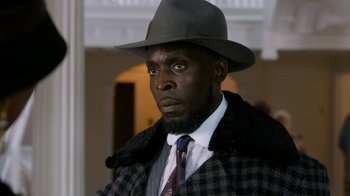 Movie still from “Bessie” (2015), directed by Dee Rees – A man in a hat and a coat; Close Up shot, Low angle