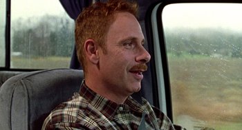 Movie still from “Best in Show” (2000), directed by Christopher Guest – A person sitting in a car; Close Up shot, Over the shoulder angle