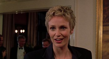 Movie still from “Best in Show” (2000), directed by Christopher Guest – A person wearing a suit; Close Up shot, Over the shoulder angle